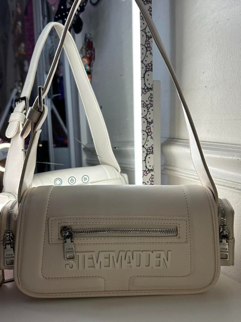 Cream Steve Madden bag with silver hardware